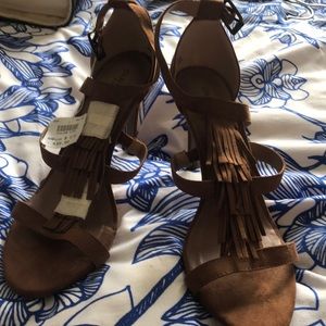 Strappy tasseled heels